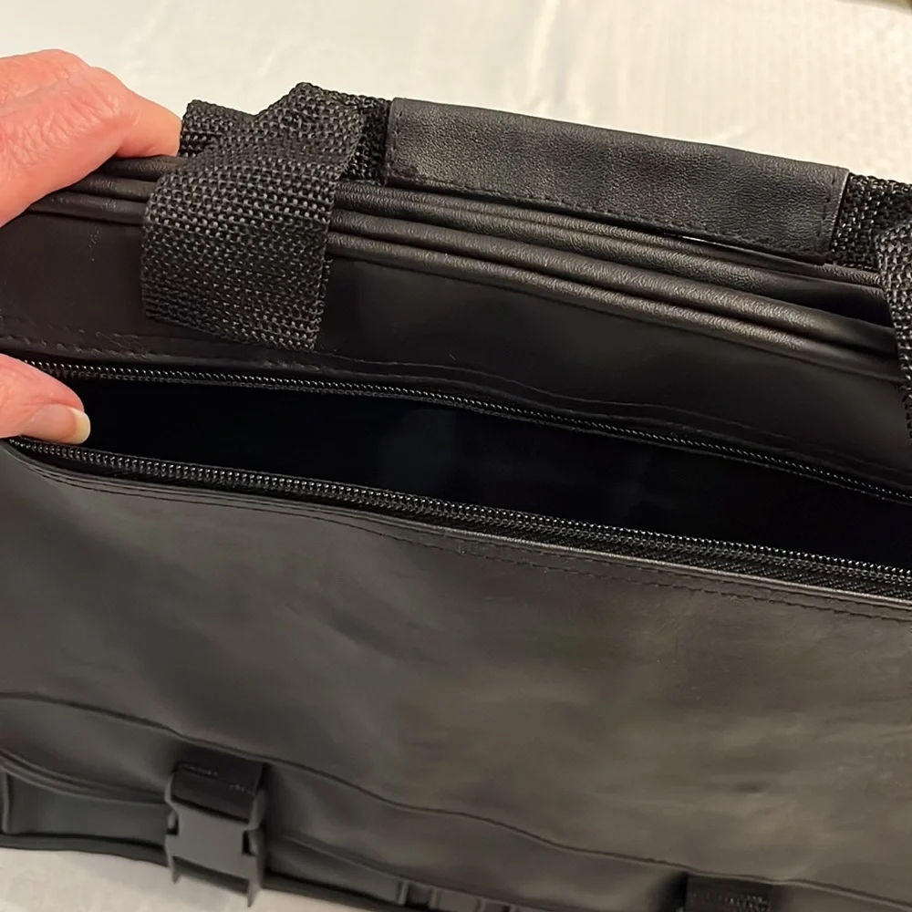 Briefcase, Black, Handles and Shoulder Straps lots of storage.